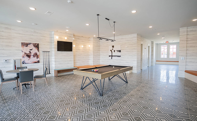 Game lounge featuring a pool table